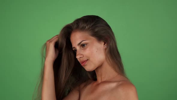 Sexy Young Beautiful Woman Playing with Her Long Healthy Hair alt