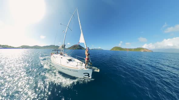 A Lady Is Filming Herself Onboard of a Sailing Boat alt