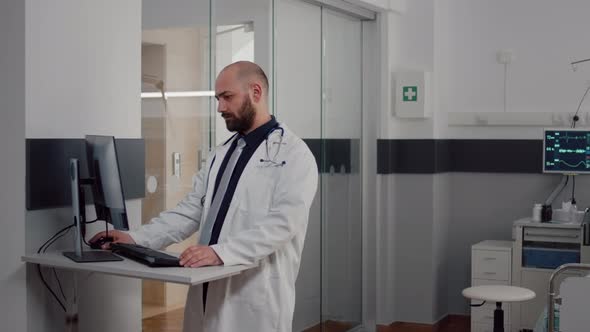 Doctor Practitioner in Uniform Analyzing Disease Diagnosis Typing Illness Treatment alt