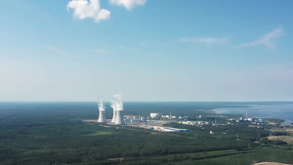 Smoking Cooling Towers at Nuclear Power Plant alt