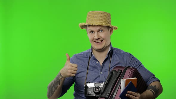 Portrait of Young Man Tourist Photographer Pointing at Something. Chroma Key alt