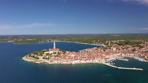 Flyby movie of the historical Croatian city Rovinj during daytime with clear skies in summer alt