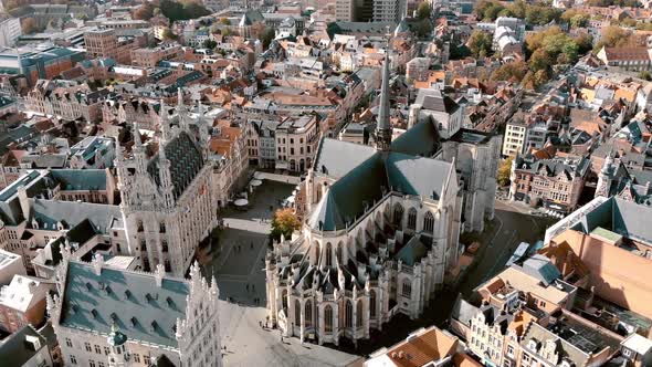 Scenic St. Peter's Church in Leuven Grote Markt - Aerial Fly-over alt
