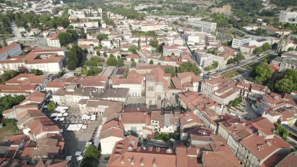 Wide drone pan showing iconic Oliveira square in Guimaraes, Portugal