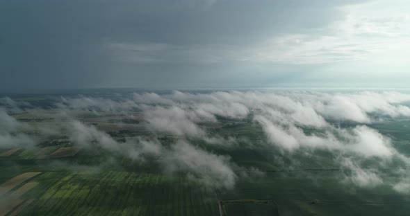 Through The Clouds Opens A Beautiful Landscape Of Fields And Roads With Transport alt