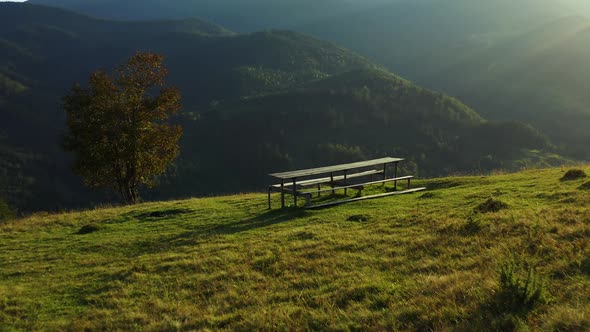 Bench Green Mountains Nobody Sit Against Impressive Rocky Landscape Sunlights alt