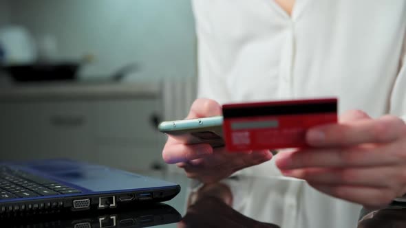 Woman Hold Credit Card and Use Smartphone