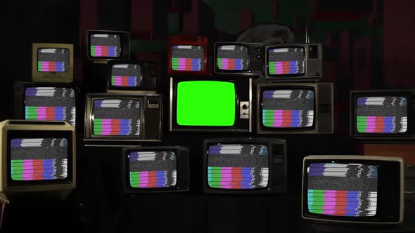 Retro TV Green Screen Among Many Old TVs with Test Card Pattern.