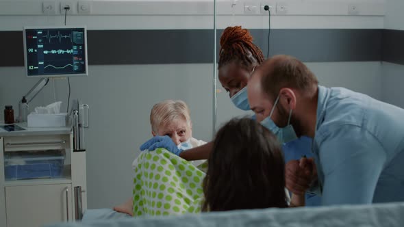 Caucasian Family in Childbirth Labor Getting Medical Assistance alt