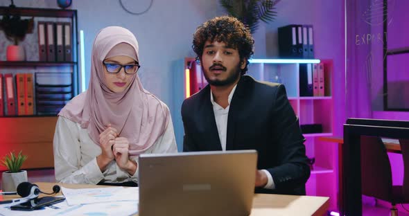 Male and Female Workmates which Brainstorming over Joint Business Strategy Using Documents alt