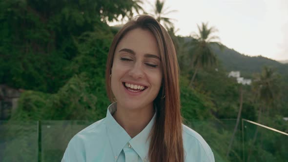 Woman Doing a Video Chat of Tropical Forest Background  POV Camera alt