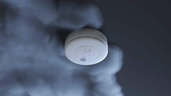 Dense smoke gathering around a smoke detector. Activated alarm. Light blinking. alt