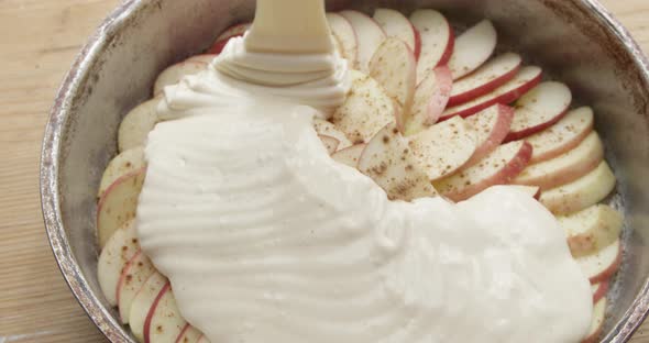Cooking Apple Pie A Close Up Top Shot Of A Pan With Apples And Dough alt