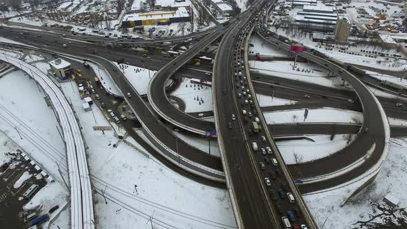 Aerial View Cars Driving on Winter Highway, Car Traffic on Snowy Freeway Road alt