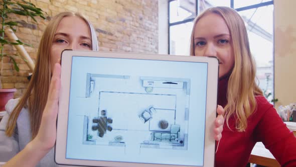 Female Colleagues Presenting Interior Design via Web Call