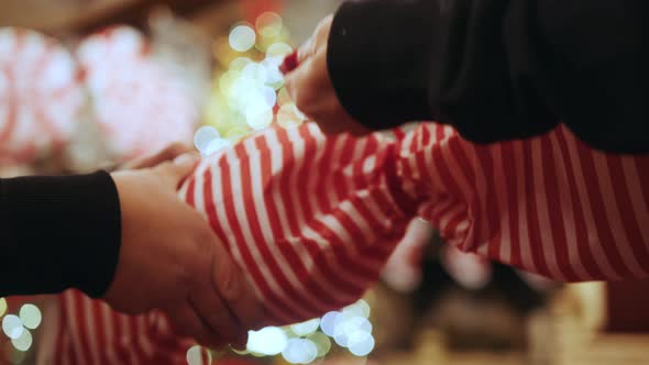 Close Up of Female Hands Making a Big Christmas Decoration in the Form of alt