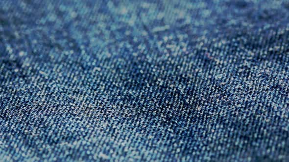 Close up from rotating blue denim material