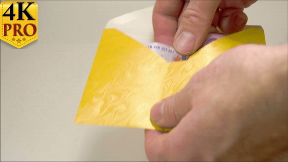 A Yellow Small Envelope with 3 Euro Bills alt