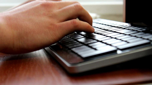 Man Hands Typing on Keyboard
