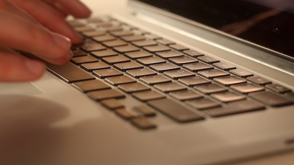 Man Typing On A Keyboard