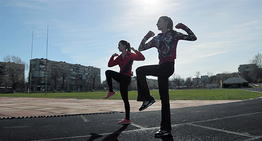 Sports Training Two Girls Female Athletes On The Treadmill