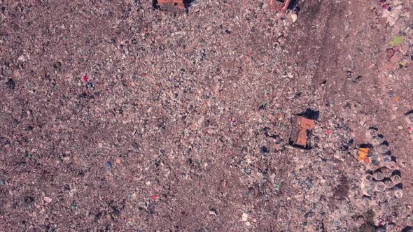 Garbage Dump Top View Working People and Bulldozers. Ukraine, the Environmental Problem of Unsorted