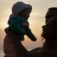 Silhouettes Of Father And Mother With Baby At - VideoHive Item for Sale