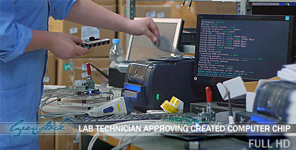 Lab Technician Approving New Computer Chip