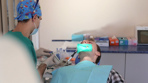 Dentist Treats a Patient alt