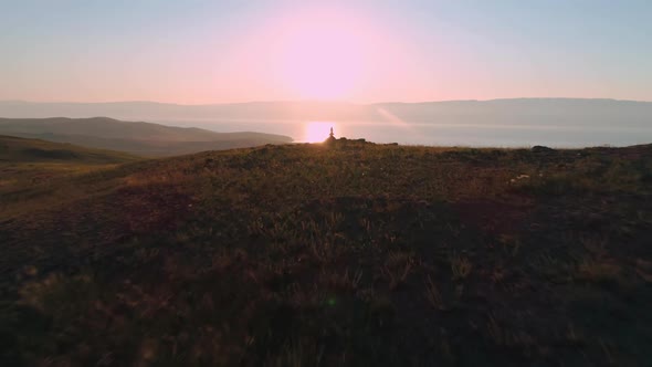 Aerial Field of Dry Yellow Grass. Steppe on Olkhon Island. Lake Baikal, Russia. Drone Footage Hills alt