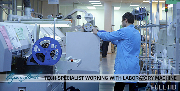 Tech Specialist Working With Laboratory Machine