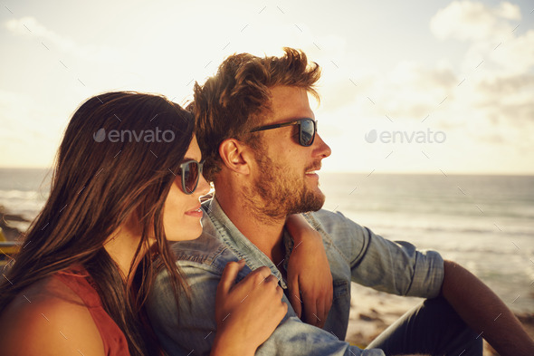 Beautiful young couple enjoying the view - Stock Photo - Images