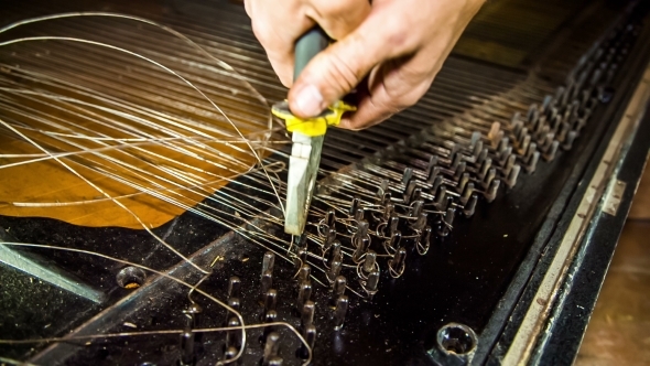 Dismantling Process Of Old Piano Strings With