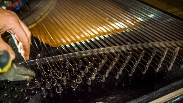 Disassembly Process Of Old Piano Strings. Time
