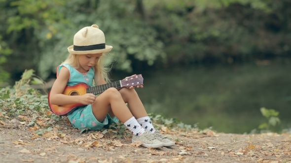 Little Blond Girl In A Straw Hat Sitting , Stock Footage 