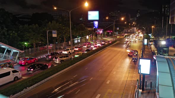 road traffic in the night city. many cars in a big city in Bangkok alt