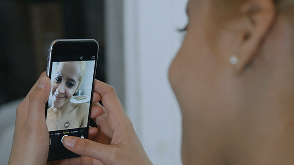 Girl Taking Selfies alt