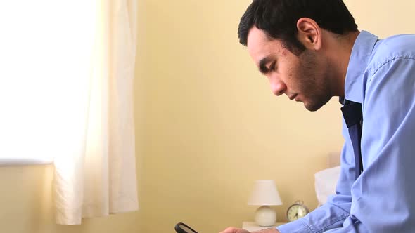 Businessman Texting In Bed alt