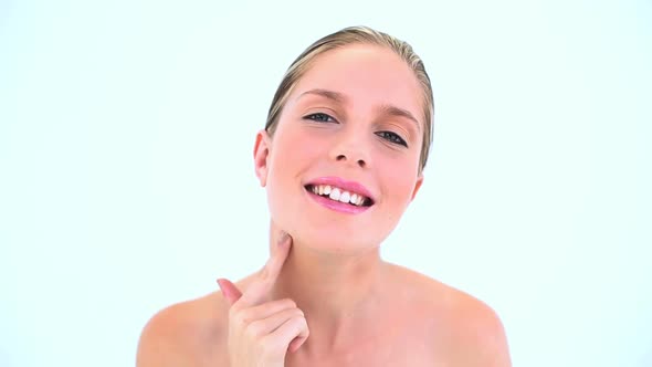 Pretty Woman Spreading Cream On Her Neck alt