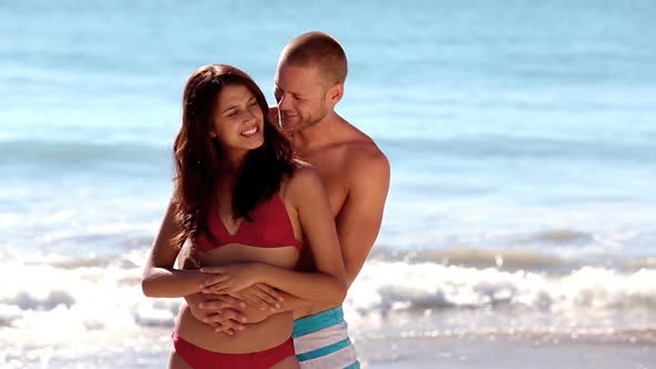 Attractive Couple Embracing Together alt