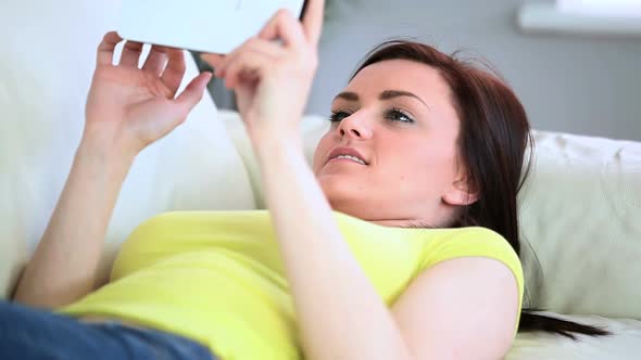 Attractive Woman Lying On Couch alt