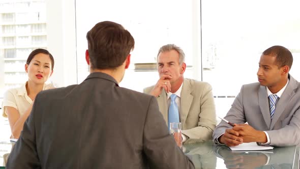 Businessman Being Interviewed By Tough Panel alt