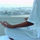 Woman Relaxing On The Beach Practicing Yoga - VideoHive Item for Sale