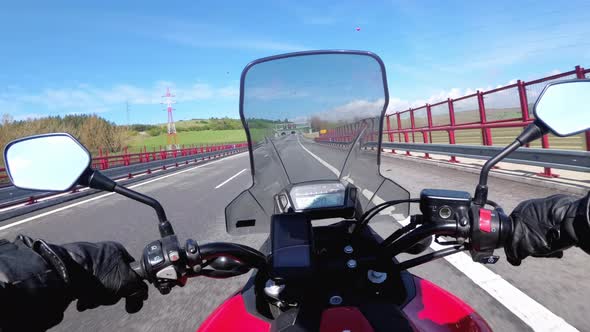 Motorcyclist Riding on Highway. View From Behind the Wheel of a Motorcycle. POV alt