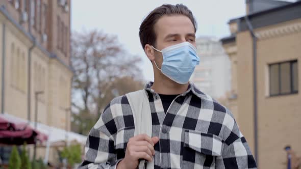 Portrait of guy with protective face mask.