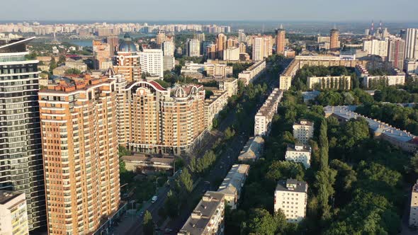 Aerial drone video of downtown apartment buildings and cars on the highway in Pecherskyi district of alt