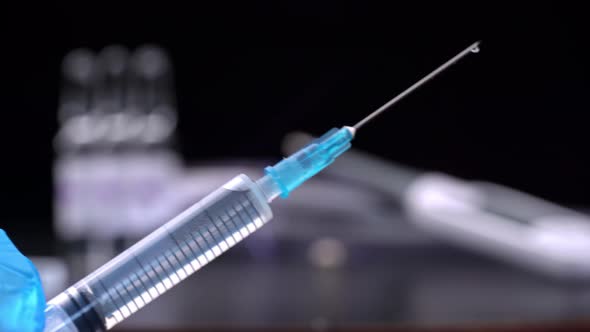 Learstvo is Dripping From Medical Syringe Flowing Down in Large alt