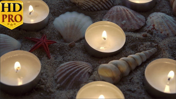 Six Candles and Some Seashells on the Sand