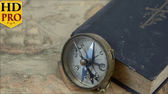 Zoom Out View of the Compass with the Book
