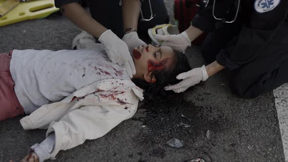 Team of Paramedics Rescuing Indian Child on Road alt